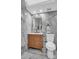 Bathroom with modern vanity, black accents, stylish mirror, and tiled walls at 2211 Belleair Rd # D3, Clearwater, FL 33764