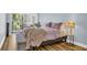 Comfortable bedroom with ample natural light, a cozy bed, and a serene, relaxing atmosphere at 2211 Belleair Rd # D3, Clearwater, FL 33764
