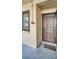 Front entrance with a brown door and a window at 2211 Belleair Rd # D3, Clearwater, FL 33764