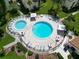 Aerial view of a community pool area with lounge chairs at 2211 Belleair Rd # D3, Clearwater, FL 33764