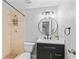 Bathroom featuring modern vanity, updated fixtures, and a walk-in shower at 2214 Selkirk St, Valrico, FL 33594