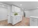 Contemporary kitchen featuring white cabinets, modern hardware and quartz countertops at 2214 Selkirk St, Valrico, FL 33594