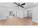 Spacious open floor plan featuring modern lighting and updated flooring throughout at 2214 Selkirk St, Valrico, FL 33594