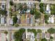 Aerial view showing a residential lot with a gray roof building and surrounding properties in a neighborhood setting at 2217 Stuart St, Tampa, FL 33605