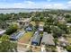 Charming neighborhood view featuring colorful homes, mature trees, and a waterfront backdrop under a clear blue sky at 2217 Stuart St, Tampa, FL 33605