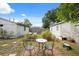 Picturesque backyard setting with a cozy patio area and lush garden, perfect for relaxing and entertaining guests at 2217 Stuart St, Tampa, FL 33605