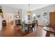 Bright dining room with hardwood floors, classic light fixture, and natural light at 2217 Stuart St, Tampa, FL 33605
