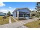 Charming single Gathering home featuring a screened-in front porch and long driveway at 2217 Stuart St, Tampa, FL 33605