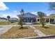 Charming single Gathering home featuring a screened-in front porch and a well-maintained lawn at 2217 Stuart St, Tampa, FL 33605