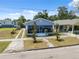 Inviting single-story home with a screened porch and well-maintained landscaping, offering curb appeal and charm at 2217 Stuart St, Tampa, FL 33605