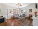 Comfortable living room featuring hardwood floors, a large sofa, and ample natural light at 2217 Stuart St, Tampa, FL 33605