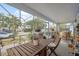 Inviting screened-in porch featuring an outdoor seating area, perfect for relaxation at 2217 Stuart St, Tampa, FL 33605