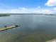 Scenic waterfront view featuring a picturesque pier with a charming gazebo under a clear blue sky, creating a peaceful retreat at 2217 Stuart St, Tampa, FL 33605
