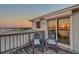 Balcony view with seating showcasing sunset on the intercoastal waterway at 2417 Sunset Vista Dr, Spring Hill, FL 34607