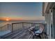 Balcony view with seating showcasing sunset on the intercoastal waterway at 2417 Sunset Vista Dr, Spring Hill, FL 34607