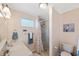 Bathroom features a walk-in shower, light-colored walls, toilet, and single sink vanity at 2417 Sunset Vista Dr, Spring Hill, FL 34607