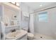 Clean bathroom with a shower and tiled walls and vanity at 2417 Sunset Vista Dr, Spring Hill, FL 34607