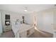 Bright bedroom features a ceiling fan and an attached bathroom at 2417 Sunset Vista Dr, Spring Hill, FL 34607