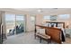 Bedroom with water view, wood frame bed, light carpet, sliding glass door leading to a deck at 2417 Sunset Vista Dr, Spring Hill, FL 34607