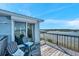 Home deck features chairs with a water view at 2417 Sunset Vista Dr, Spring Hill, FL 34607