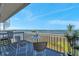 Outdoor patio showing lounge area with scenic water views and spiral staircase at 2417 Sunset Vista Dr, Spring Hill, FL 34607