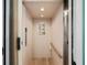 Private residential elevator with wood paneled walls and safety features at 2417 Sunset Vista Dr, Spring Hill, FL 34607