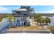 Coastal home featuring outdoor stairs, balconies and stunning views of the water at 2417 Sunset Vista Dr, Spring Hill, FL 34607