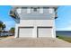 Exterior elevation with a 2-car garage and waterfront views at 2417 Sunset Vista Dr, Spring Hill, FL 34607
