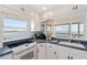 Bright kitchen with white cabinets, and a stunning waterfront view at 2417 Sunset Vista Dr, Spring Hill, FL 34607