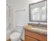 Bathroom featuring a granite countertop, sink, mirror, tub and shower combo at 2907 Mingo Dr, Land O Lakes, FL 34639