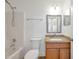 Bathroom featuring a granite countertop, sink, mirror, tub and shower combo at 2907 Mingo Dr, Land O Lakes, FL 34639