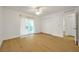 A bright bedroom features wood floors, sliding glass doors, and a closet at 2907 Mingo Dr, Land O Lakes, FL 34639