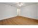 Bright bedroom with wood-look floors and a ceiling fan at 2907 Mingo Dr, Land O Lakes, FL 34639