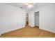 A bright bedroom features wood floors, a ceiling fan, and a closet at 2907 Mingo Dr, Land O Lakes, FL 34639