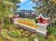 Suncoast Pointe community sign with lush landscaping and neighborhood playground at 2907 Mingo Dr, Land O Lakes, FL 34639