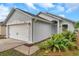Charming one-story home featuring an attached garage and well-maintained landscaping at 2907 Mingo Dr, Land O Lakes, FL 34639