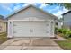 Close up of a well-maintained garage door at house number 2907 with black hardware at 2907 Mingo Dr, Land O Lakes, FL 34639