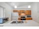 Kitchen with stainless appliances, updated countertop, wood cabinets, and mosaic backsplash at 2907 Mingo Dr, Land O Lakes, FL 34639