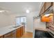 Kitchen with stainless appliances, wood cabinets, updated countertop, and mosaic backsplash at 2907 Mingo Dr, Land O Lakes, FL 34639