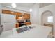 Kitchen with stainless appliances, updated countertop, wood cabinets, and mosaic backsplash at 2907 Mingo Dr, Land O Lakes, FL 34639
