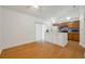 Bright kitchen features wood floors, white island, stainless appliances, and sliding door access at 2907 Mingo Dr, Land O Lakes, FL 34639