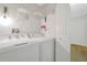 Laundry area featuring a washer, dryer, and overhead storage at 2907 Mingo Dr, Land O Lakes, FL 34639