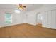 Bright living room with hardwood flooring, neutral paint, and plenty of natural light at 2907 Mingo Dr, Land O Lakes, FL 34639