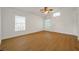 Spacious living room with hardwood floors, and multiple windows at 2907 Mingo Dr, Land O Lakes, FL 34639