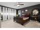 Stylish bedroom with dark gray walls, white floors, and plenty of natural light at 30 Turner St # 202, Clearwater, FL 33756