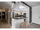 Cozy kitchen showcases granite counters, breakfast bar and contemporary pendant lighting at 30 Turner St # 202, Clearwater, FL 33756