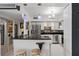 Bright kitchen features stainless appliances, granite counters, breakfast bar and modern finishes at 30 Turner St # 202, Clearwater, FL 33756