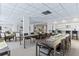 Large gathering room features seating arrangements and a serving bar connected to the kitchen area at 30 Turner St # 202, Clearwater, FL 33756