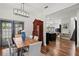 Elegant dining area with a wooden table, comfortable seating, and access to outdoor space at 3221 W Oakellar Ave, Tampa, FL 33611