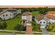 Aerial view of a luxury home showcasing its tile roof, landscaping, and prime location at 3585 Torino Ln, Palm Harbor, FL 34683